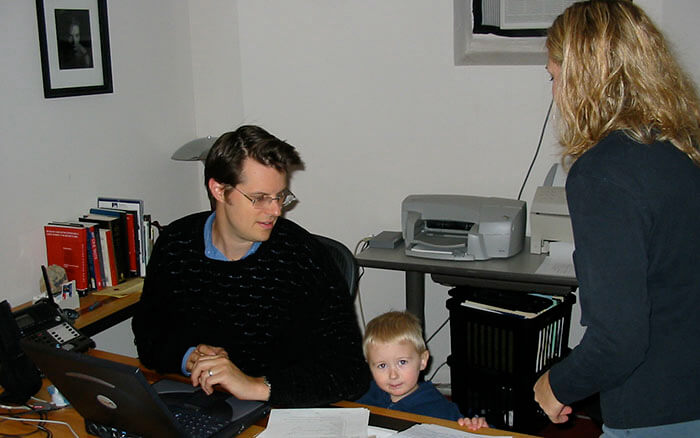 The Carnes family in a tiny basement office.