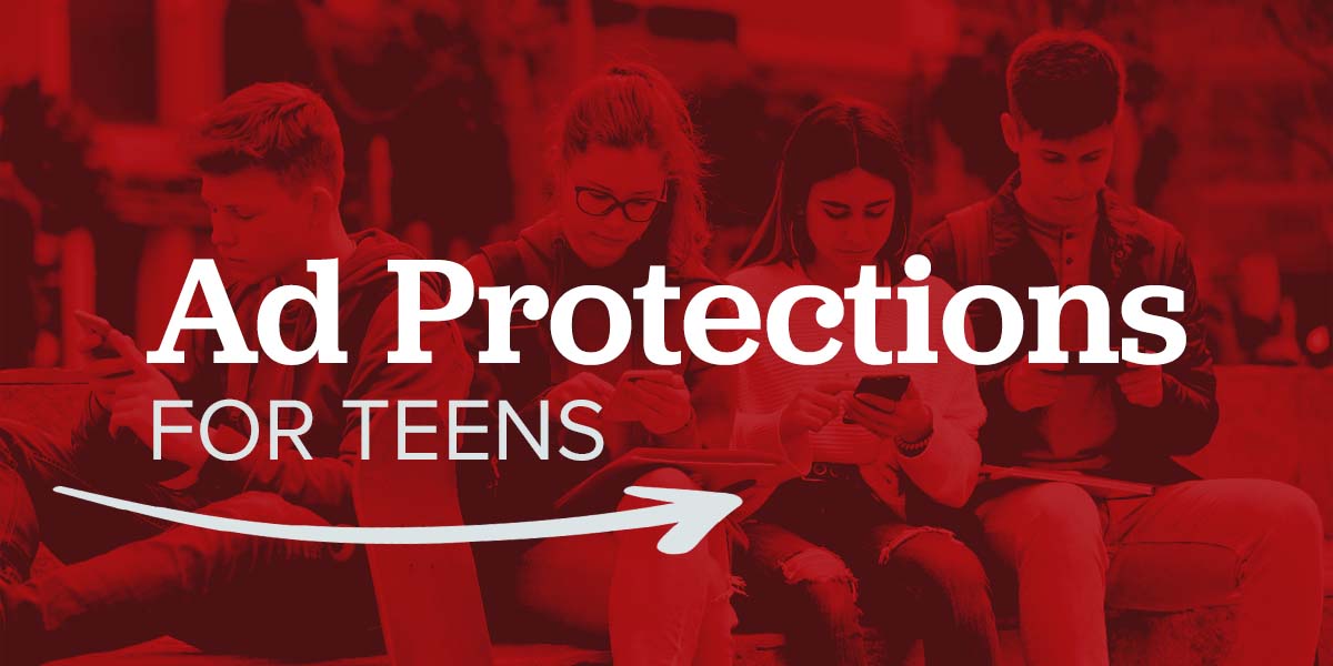 Teens sitting together on their mobile devices.