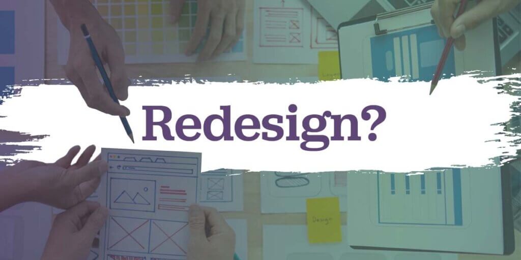 A team planning a website redesign with paper drawings.