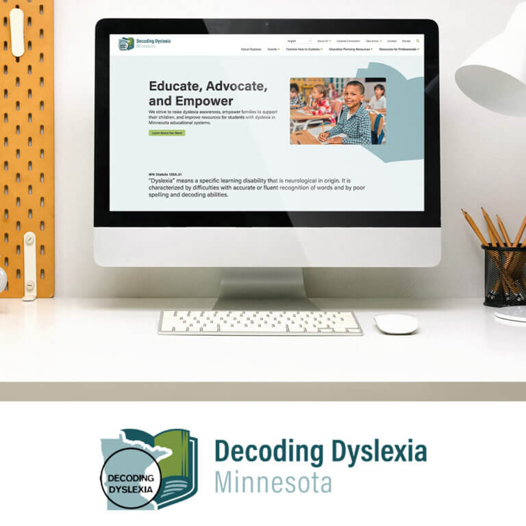 Decoding Dyslexia's new website on monitor with logo underneath.