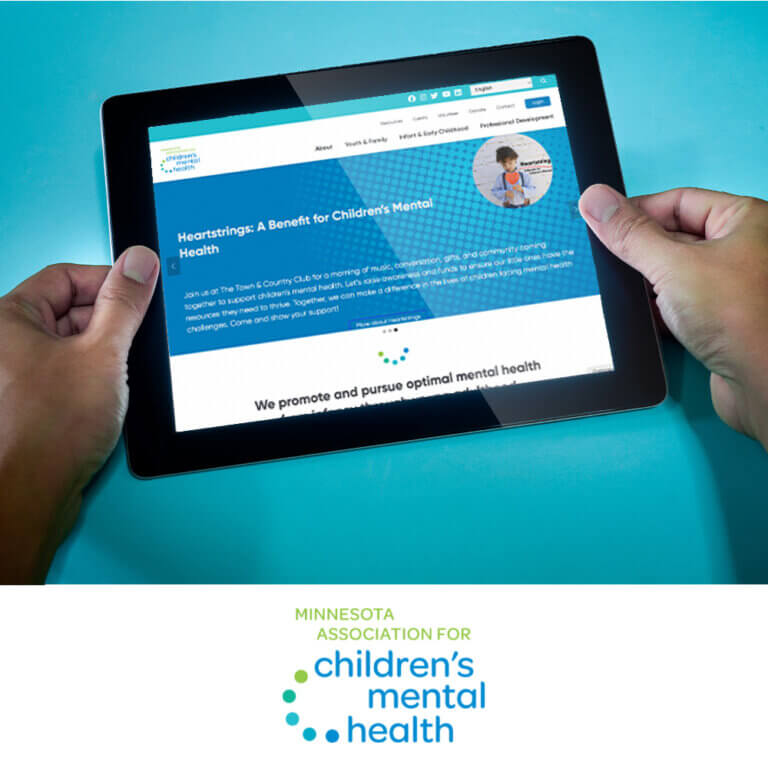 MACMH's new website on tablet screen with logo under.