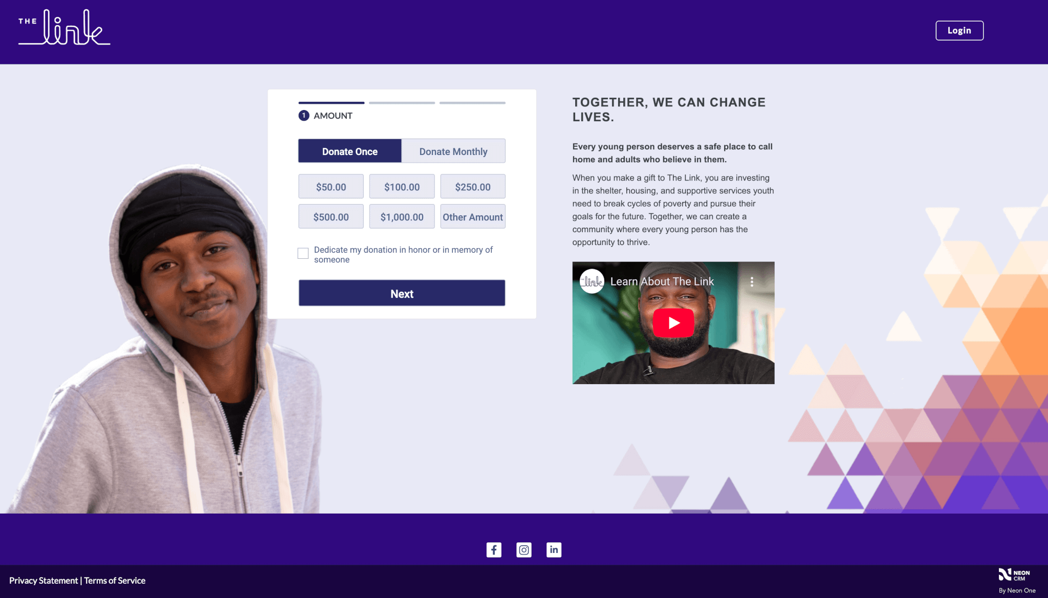 Screenshot of a donation page for The Link, a nonprofit organization. On the left, a young person in a gray hoodie and black headwrap smiles at the camera. In the center, a donation form offers options to donate once or monthly, with preset amounts ($50, $100, $250, $500, $1,000, or other). A checkbox below allows dedications. On the right, a message reads “Together, we can change lives,” with text about providing safe spaces for youth, and an embedded video titled “Learn About The Link.” The background features orange and purple geometric triangle patterns. Social media icons and Neon CRM branding appear at the bottom.