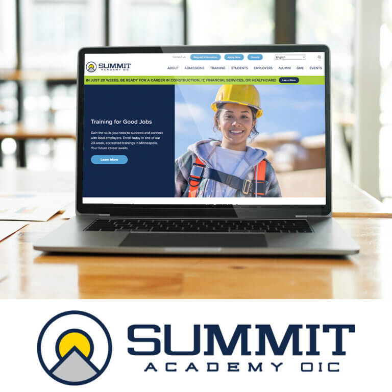 Laptop displaying the redesigned Summit Academy OIC website on a wooden table, featuring a smiling woman in a hard hat and harness promoting job training programs. Below the laptop is the Summit Academy OIC logo with a stylized mountain and sun graphic.