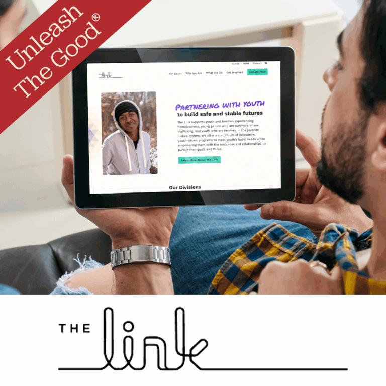 A person holding a tablet on their lap, viewing the homepage of The Link, a nonprofit organization that partners with youth to build safe and stable futures. The screen displays a photo of a young person in a hoodie and text describing The Link’s mission. In the top left corner of the image is a red banner that says “Unleash The Good®.” Below is The Link’s logo in a stylized handwritten font.