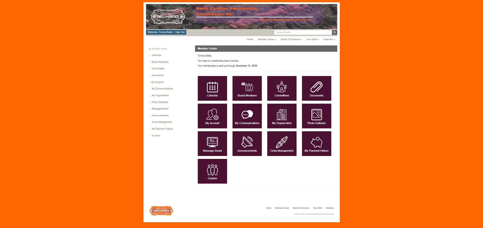 A webpage from the North Carolina Sweetpotato Commission member portal. The header features the logo with “Supporting North Carolina farmers since 1961.” Below, it greets the logged-in user “Tommy Batts” and confirms membership paid through December 31, 2030. The main section titled “Member Center” displays large square icons with labels: Calendar, Board Members, Committees, Documents, My Account, My Communications, My Organization, Photo Galleries, Message Board, Announcements, Crisis Management, My Payment History, and Custom. A vertical navigation menu with the same options appears on the left side.
