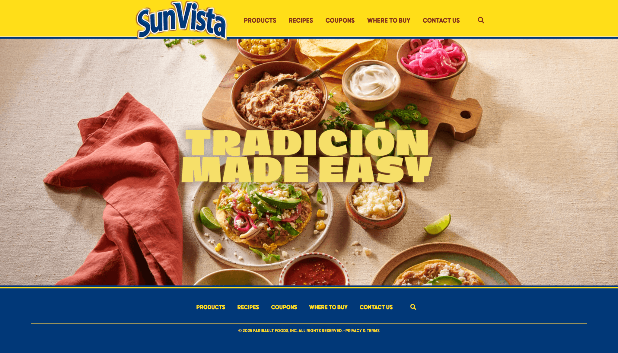 Homepage of SunVista featuring a yellow and blue header with the SunVista logo and navigation links for products, recipes, coupons, and contact. Below, a colorful food spread includes tostadas topped with beans, pickled onions, cheese, and fresh vegetables beside bowls of sour cream, refried beans, corn, and salsa. Bold yellow text reads “TRADICIÓN MADE EASY,” highlighting the brand’s focus on convenient, authentic Mexican-style meals.