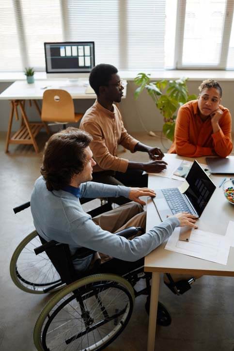 A center for independent living web team working together.