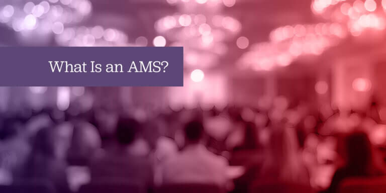 Blurred conference hall with attendees, overlaid with purple and red tones and the text 'What Is an AMS?